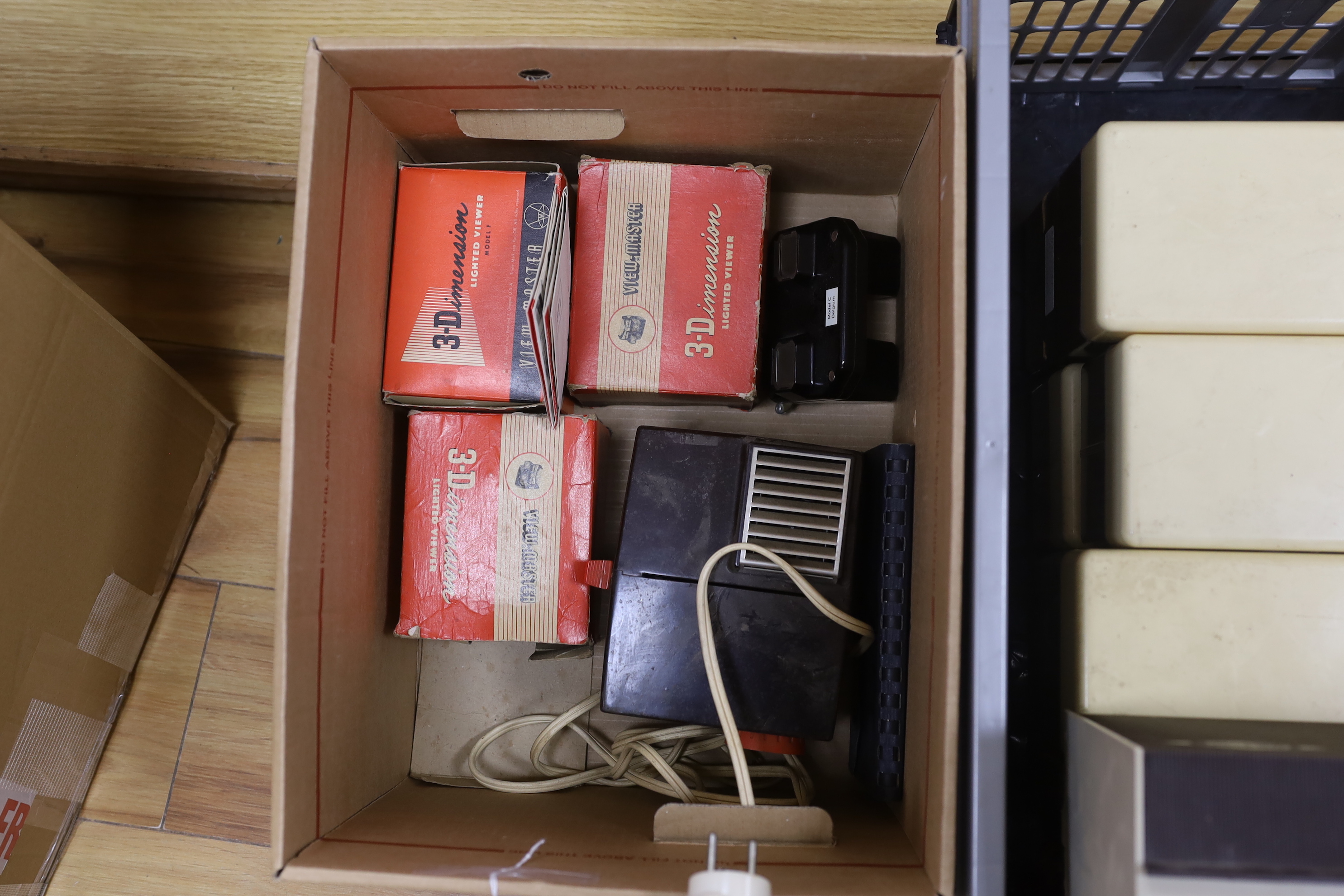 Three View-Master projectors and four View-Master viewers, together with eight View-Master plastic boxes containing a large quantity of reels with subjects including views of the United States, National Parks, Italy, Ger